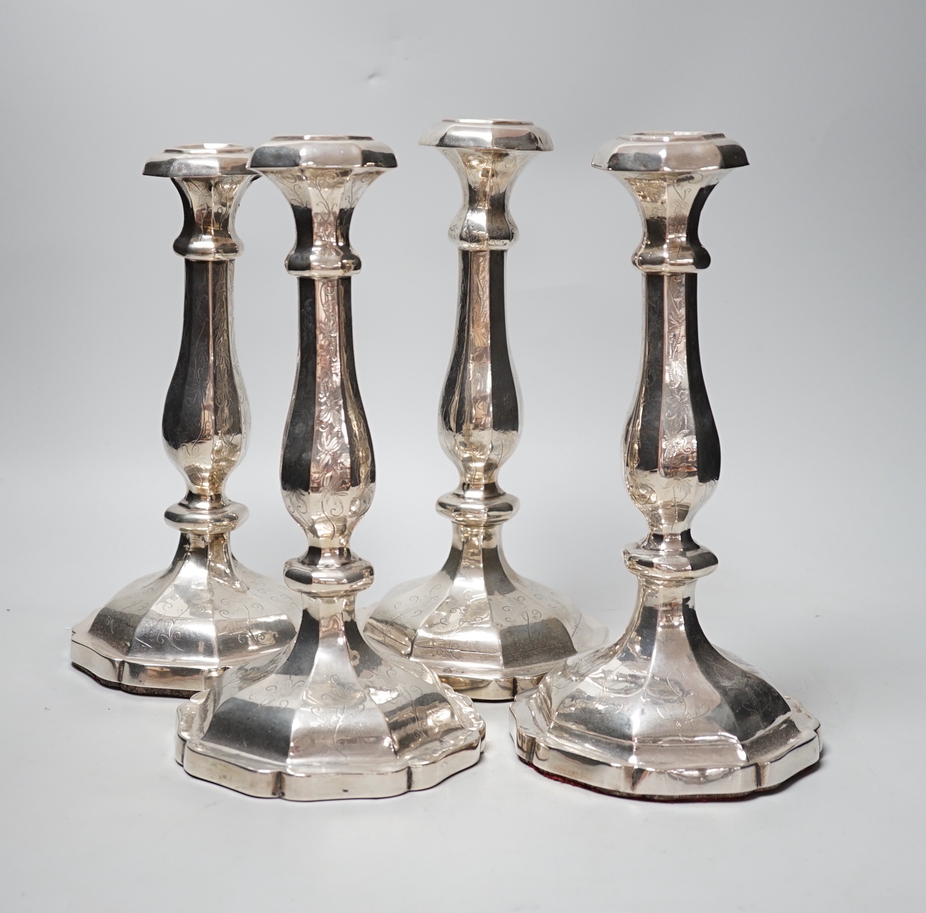 A set of four 19th century Austro-Hungarian white metal candlesticks, dated 1863, height 27.4cm, et infra (a.f.), weighted.